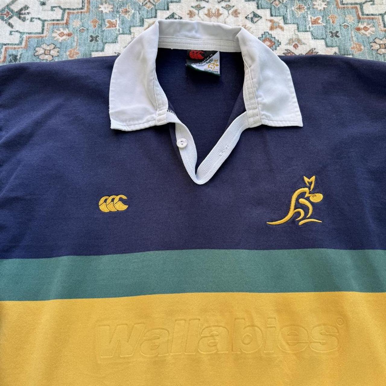 Canterbury men's long sleeve rugby polo green with Australia Wallabies logo and embroidered details.