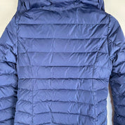Moncler blue puffer jacket with logo detail and quilted design.