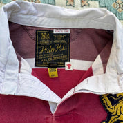 Polo Ralph Lauren burgundy rugby polo shirt with embroidered athletic team logo.