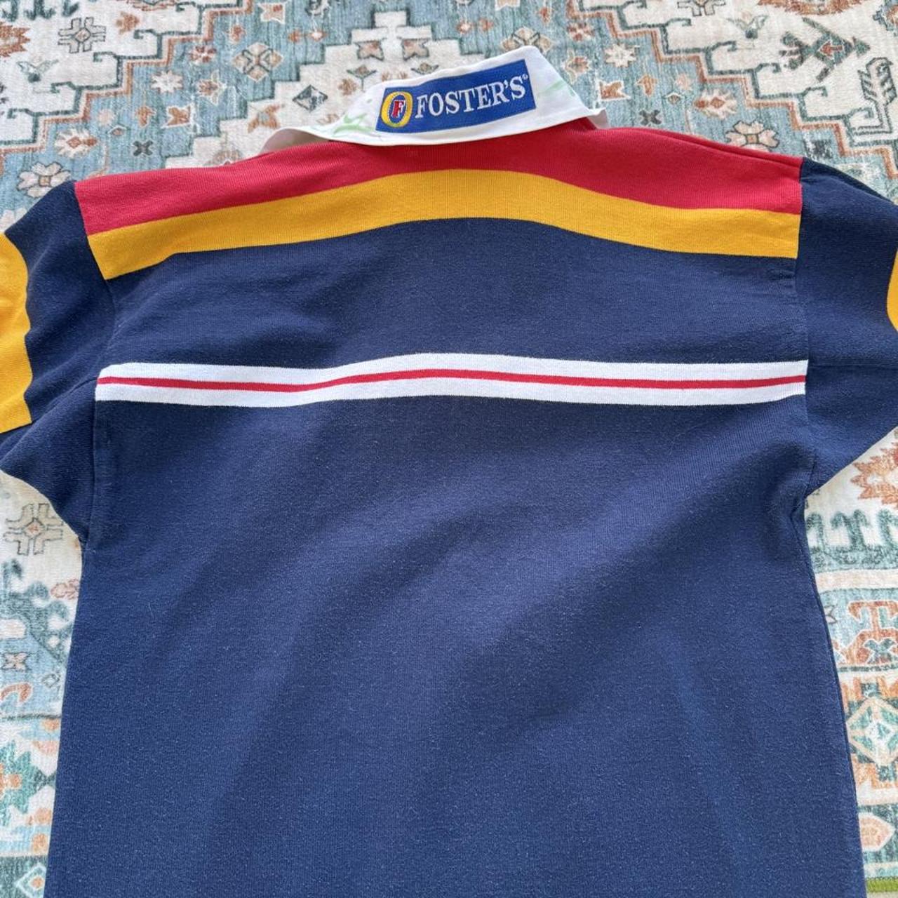 Canterbury men's polo shirt blue with embroidered London Broncos logo and signature.