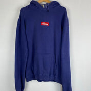 Stüssy blue oversized hoodie with embroidered box logo spellout on front.