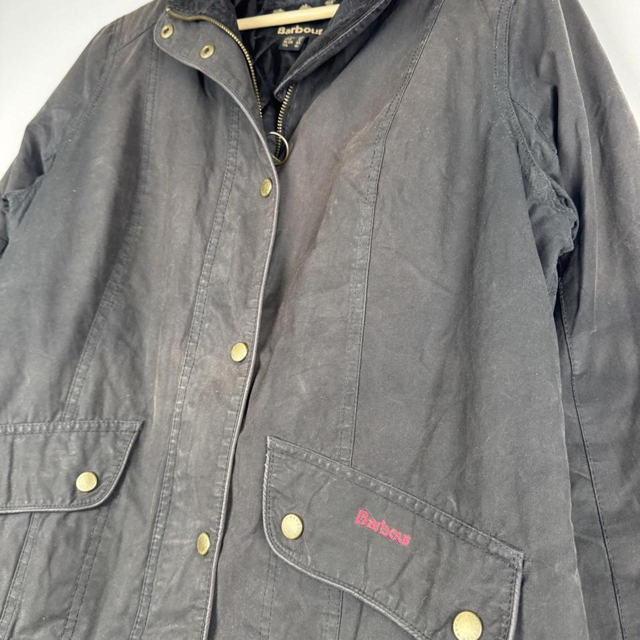 Barbour black women's winter jacket with logo detail and slim fit design.