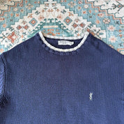 Yves Saint Laurent navy sweatshirt with white trim and embroidered YSL logo.
