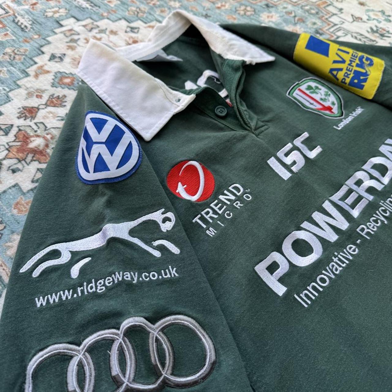 ISC green rugby polo shirt with embroidered London Irish logo and slim fit.