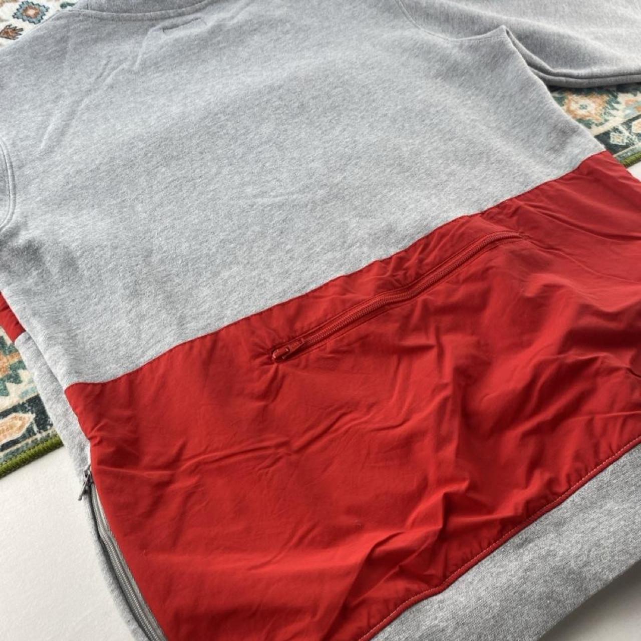 Stüssy grey sweatshirt featuring international logo and soft cotton material.