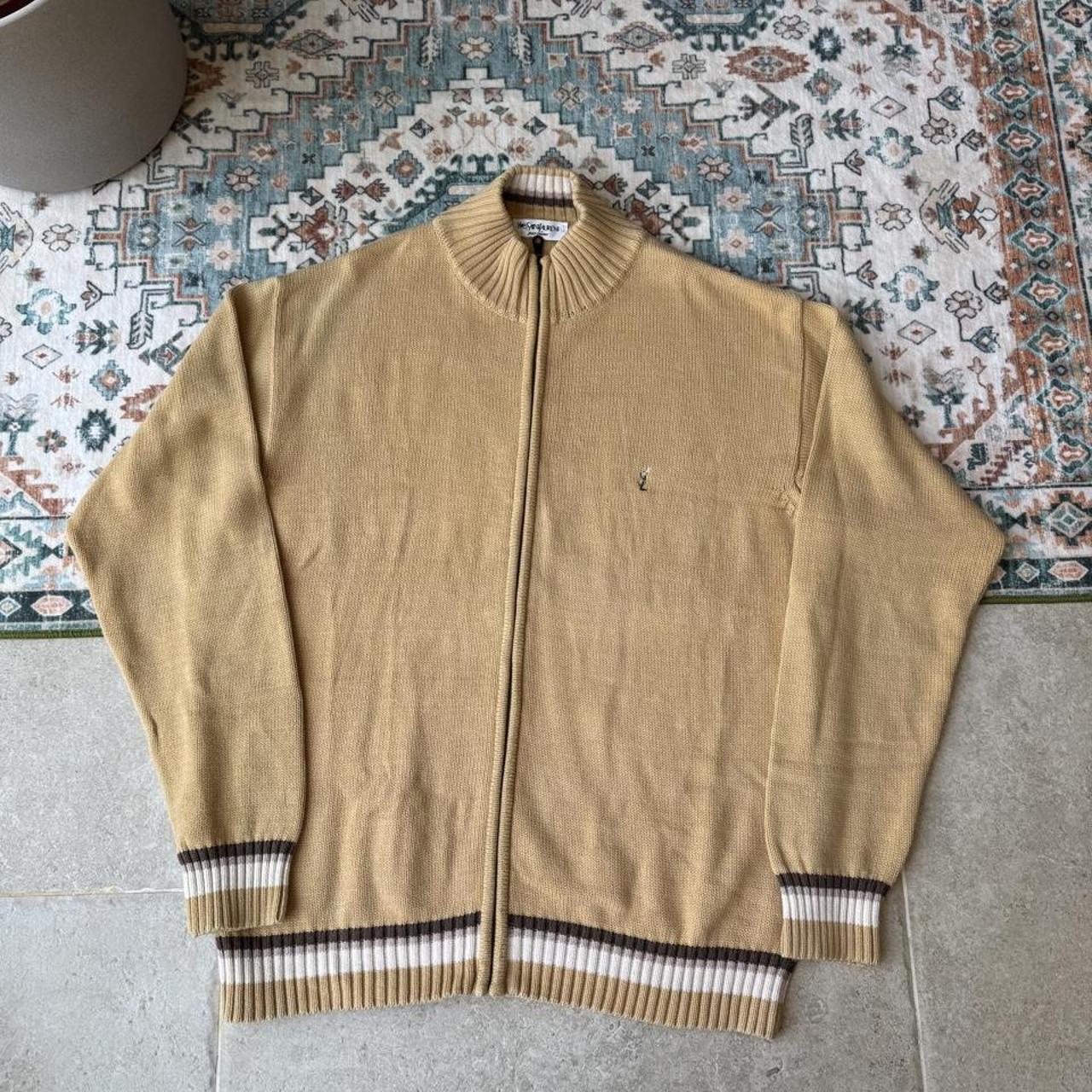 Yves Saint Laurent cream jumper with embroidered YSL logo and full zip design.
