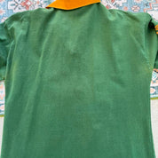 Umbro men's polo shirt green with Wallabies logo and rugby league pattern.