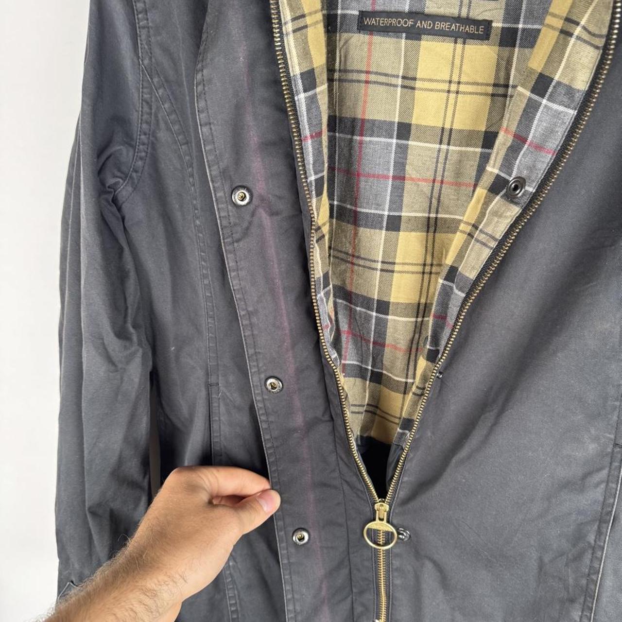 Barbour cream lightweight jacket with logo detail and slim fit design.