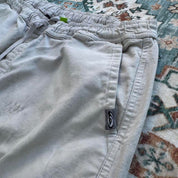 Quiksilver cream cargo shorts with embroidered logo and front pockets.