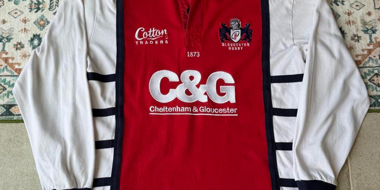 Cotton Traders long sleeve rugby polo shirt navy blue with embroidered logo and relaxed fit.