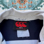 Canterbury men's rugby polo shirt, navy blue, featuring Harper Adams University logo and classic collar.