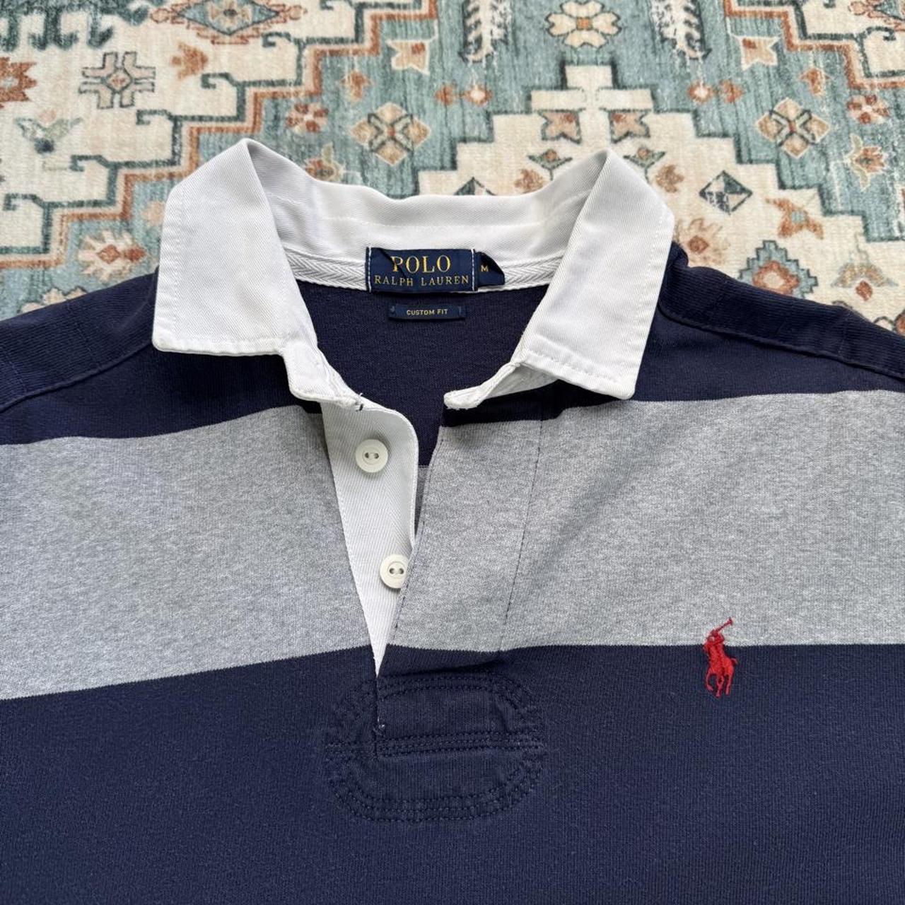 Polo Ralph Lauren navy rugby polo shirt with thick stripes and embroidered logo.
