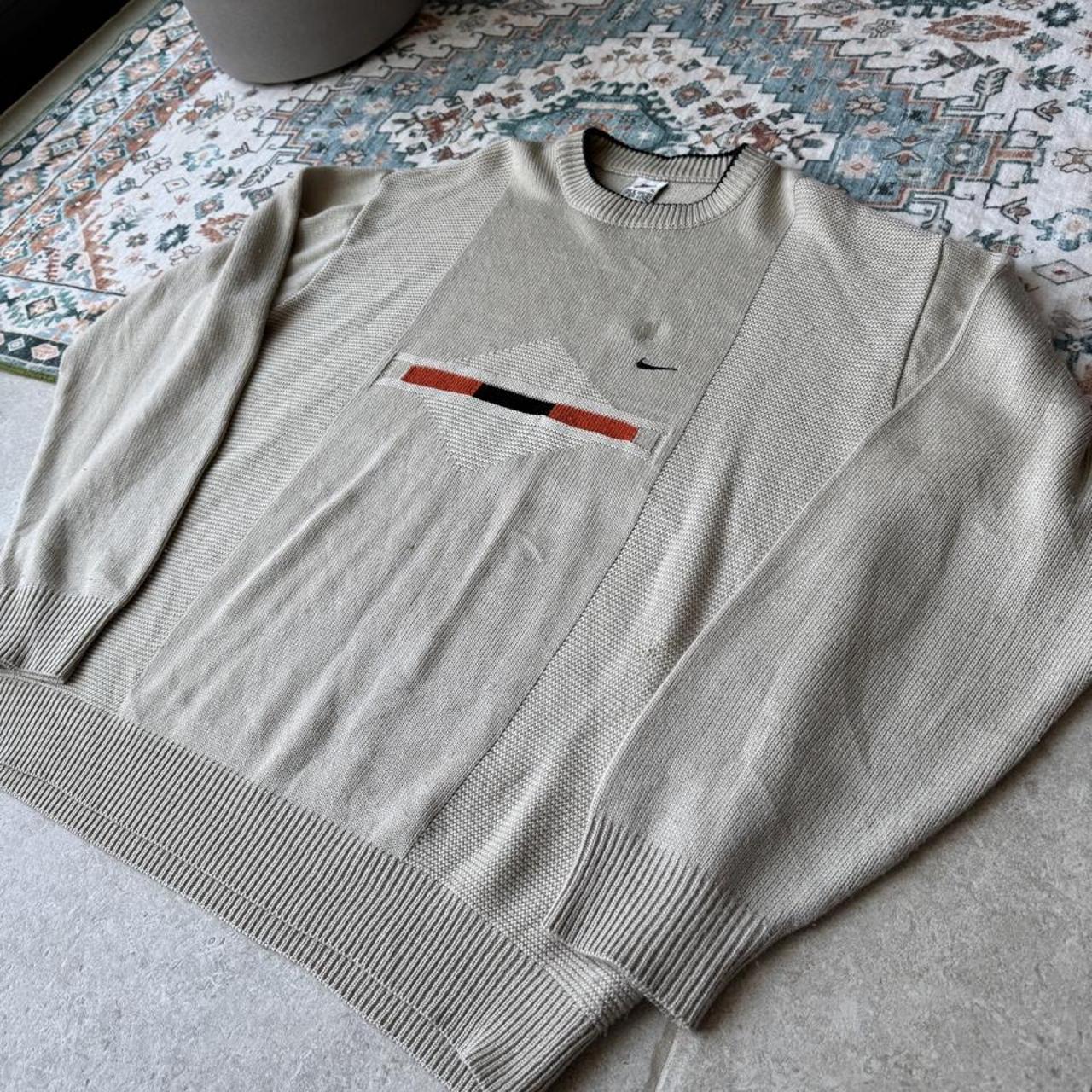 Nike cream knitted jumper with embroidered logo and visible marks from the 1990s.