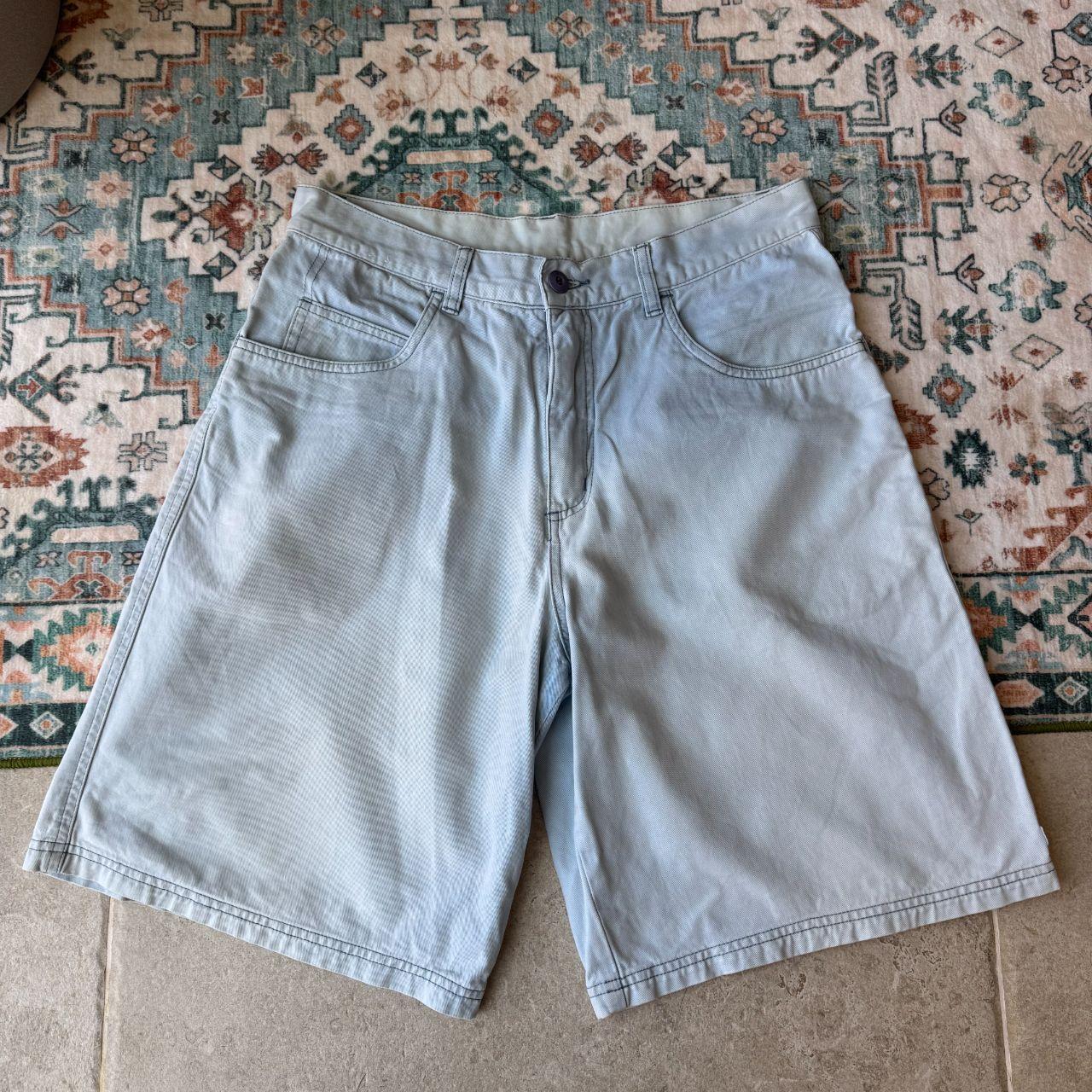 Quiksilver baby blue surf shorts 100% cotton with logo and classic design details.
