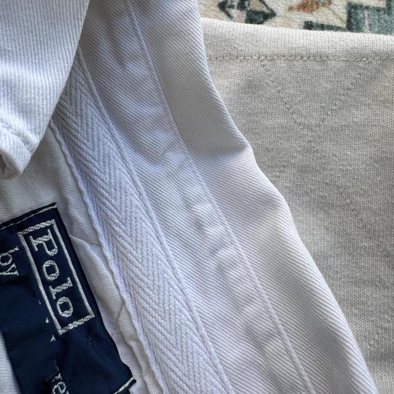 Polo Ralph Lauren cream rugby polo shirt with embroidered logo and classic collar.