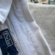 Polo Ralph Lauren cream rugby polo shirt with embroidered logo and classic collar.